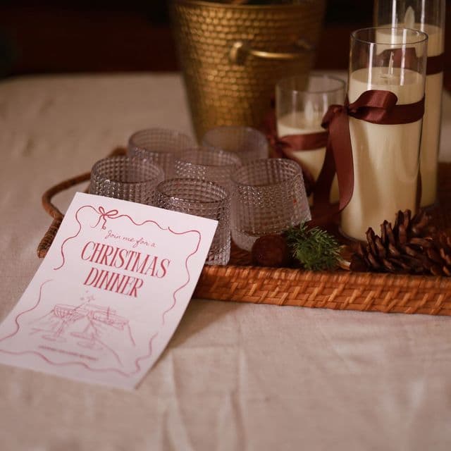 A Christmas dinner menu on a festive table