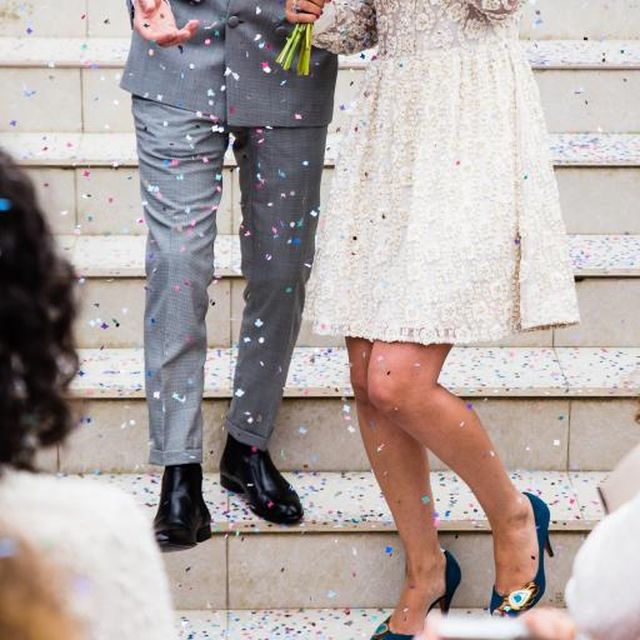 Newlyweds celebrating beneath confetti