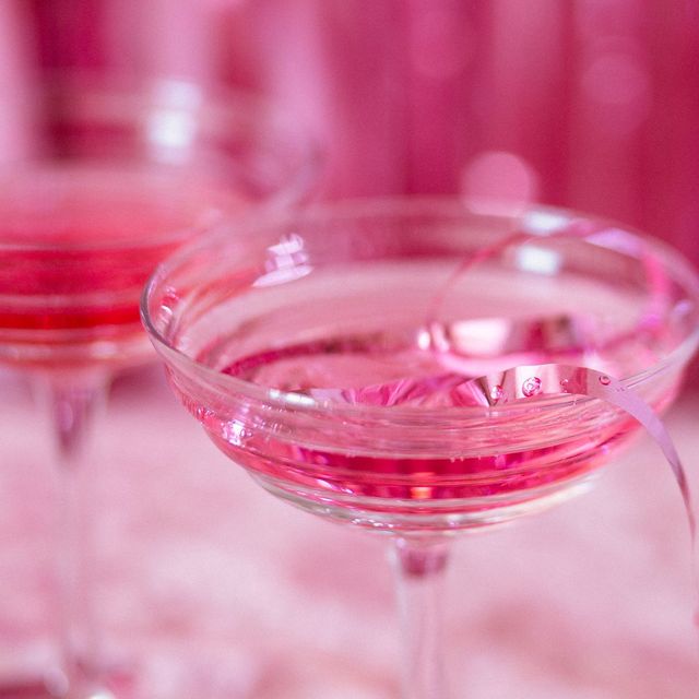 Pink cocktail coupes in bright rose light
