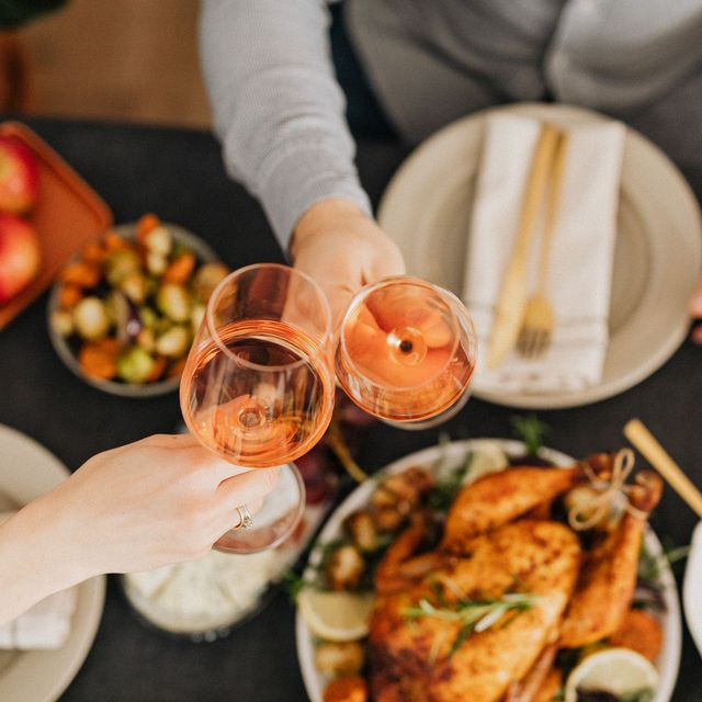 Guests sharing dinner around a laid table